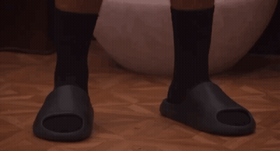 A Man Wearing Black Socks And Black Sandals GIF