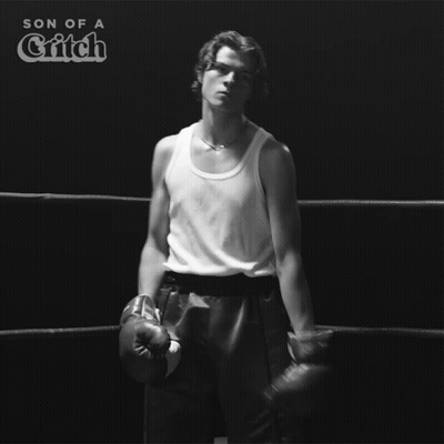 A Man Wearing Boxing Gloves Is In A Boxing Ring With The Words Son Of A Critch Above Him GIF