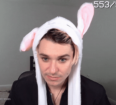 A Man Wearing Bunny Ears Has The Number 553 On The Bottom GIF