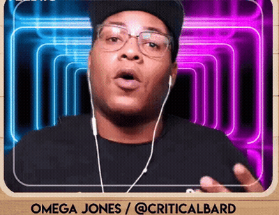 A Man Wearing Ear Buds And A Hat Says Omega Jones / @Criticalbard GIF
