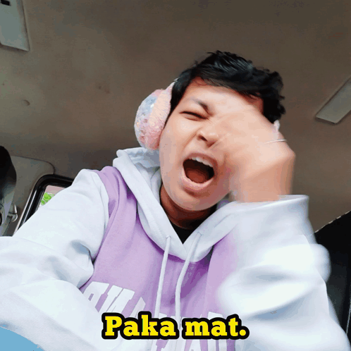 A Man Wearing Ear Muffs And A Hoodie That Says Paka Mat On It GIF