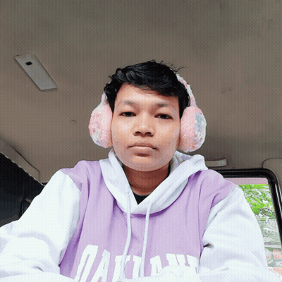 A Man Wearing Ear Warmers And A Purple Shirt That Says Dallas GIF