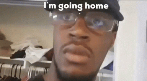 A Man Wearing Glasses And A Baseball Cap Is Going Home . GIF