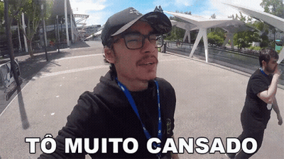 A Man Wearing Glasses And A Baseball Cap Says " To Muito Cansado " GIF