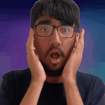 a man wearing glasses and a beard is making a surprised face