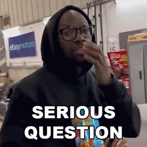 A Man Wearing Glasses And A Black Hoodie Says Serious Question While Holding A Bag Of Chips . GIF