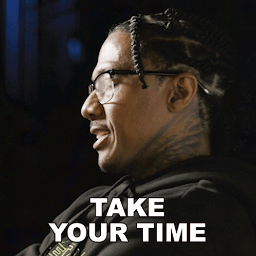 A Man Wearing Glasses And A Black Hoodie Says Take Your Time GIF