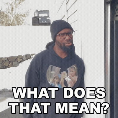 A Man Wearing Glasses And A Black Hoodie Says What Does That Mean GIF