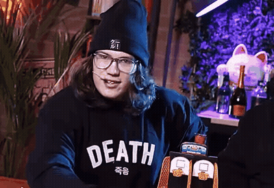 A Man Wearing Glasses And A Black Hoodie That Says Death GIF