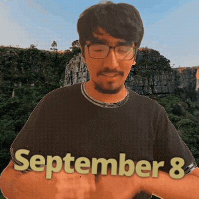A Man Wearing Glasses And A Black Shirt Has The Date September 8 On His Shirt GIF