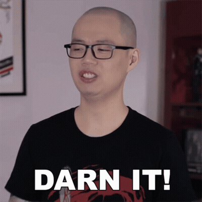 A Man Wearing Glasses And A Black Shirt Is Saying Darn It GIF