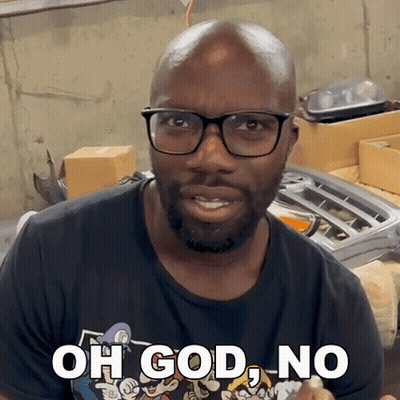 A Man Wearing Glasses And A Black Shirt Says " Oh God No " GIF