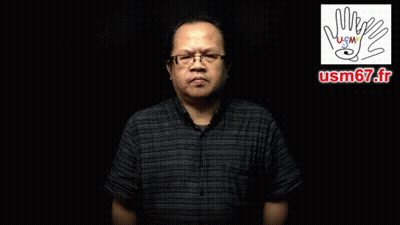 A Man Wearing Glasses And A Black Shirt Says Pour Quel Motif D' Absence GIF