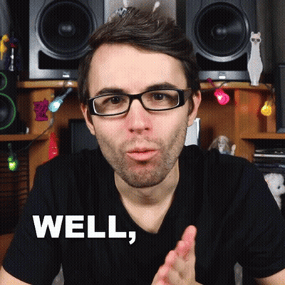 A Man Wearing Glasses And A Black Shirt Says Well In White Letters GIF