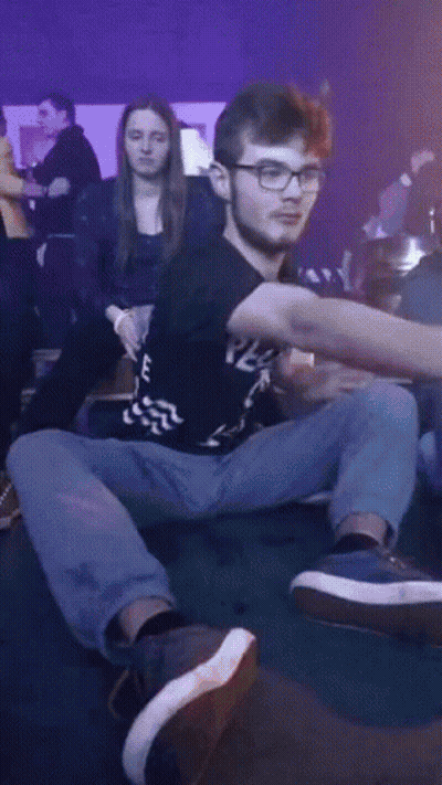 A Man Wearing Glasses And A Black Shirt That Says E On It GIF
