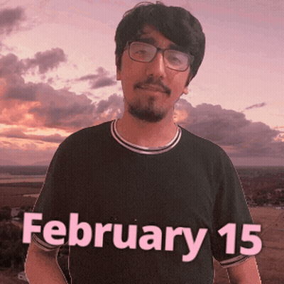 A Man Wearing Glasses And A Black Shirt That Says February 15 On It GIF