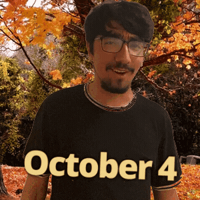 A Man Wearing Glasses And A Black Shirt That Says October 4 On It GIF
