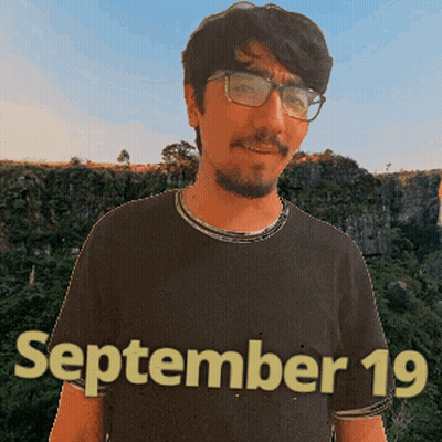 A Man Wearing Glasses And A Black Shirt That Says September 19 On It GIF