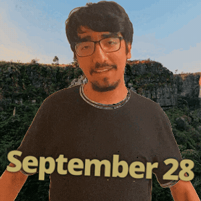 A Man Wearing Glasses And A Black Shirt That Says September 28 On It GIF