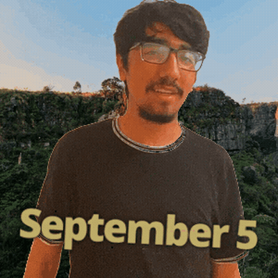 A Man Wearing Glasses And A Black Shirt That Says September 5 On It GIF