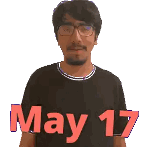 A Man Wearing Glasses And A Black Shirt With May 17 Written On It Sticker