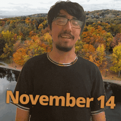 A Man Wearing Glasses And A Black Shirt With November 14 Written On It GIF