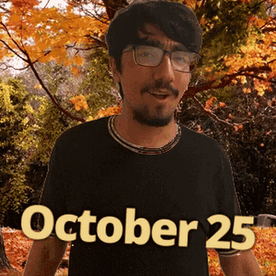 A Man Wearing Glasses And A Black Shirt With October 25 On It GIF
