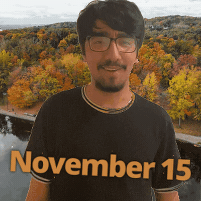 A Man Wearing Glasses And A Black Shirt With The Date November 15 On It GIF