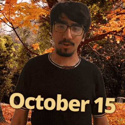 A Man Wearing Glasses And A Black Shirt With The Date Of October 15 GIF