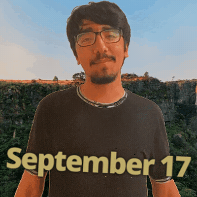 A Man Wearing Glasses And A Black Shirt With The Date September 17 Written On It GIF