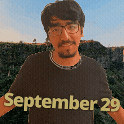 A Man Wearing Glasses And A Black Shirt With The Date September 29 On It GIF