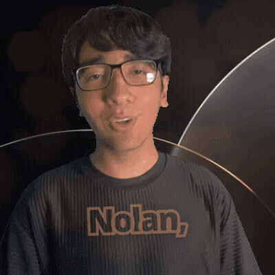 A Man Wearing Glasses And A Black Shirt With The Name Nolan On It GIF