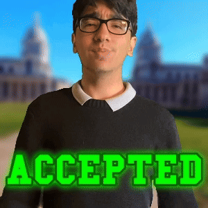 A Man Wearing Glasses And A Black Sweater With The Word Accepted In Green Letters GIF