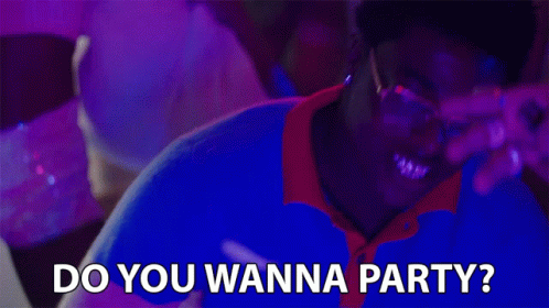 A Man Wearing Glasses And A Blue Shirt Is Asking Do You Wanna Party GIF