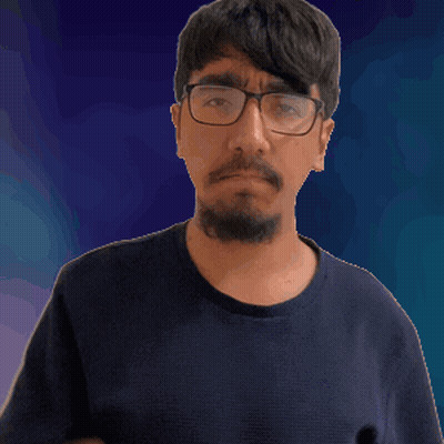 A Man Wearing Glasses And A Blue Shirt Is Pointing Up GIF