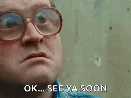 A Man Wearing Glasses And A Blue Shirt Is Saying `` Ok ... See Ya Soon '' . GIF