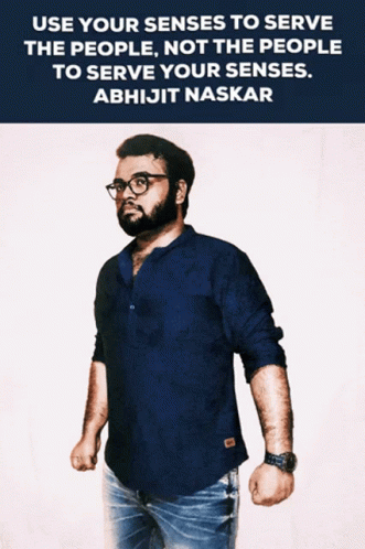 A Man Wearing Glasses And A Blue Shirt Is Standing In Front Of A Quote By Abhijit Naskar GIF