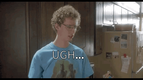 A Man Wearing Glasses And A Blue Shirt Says Ugh In Front Of A Refrigerator . GIF