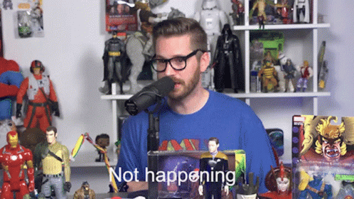 A Man Wearing Glasses And A Blue Shirt Stands In Front Of A Microphone With The Words " Not Happening " Below Him GIF