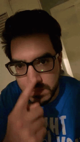 A Man Wearing Glasses And A Blue Shirt That Says Ight GIF
