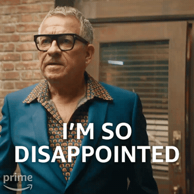 A Man Wearing Glasses And A Blue Suit Says " I 'M So Disappointed " GIF
