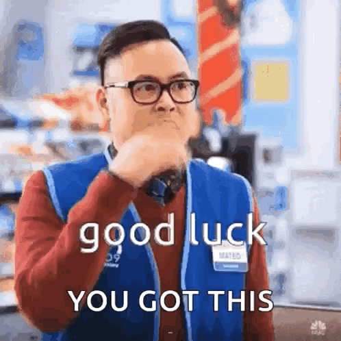 A Man Wearing Glasses And A Blue Vest Is Holding His Hand To His Mouth And Saying `` Good Luck You Got This '' . GIF