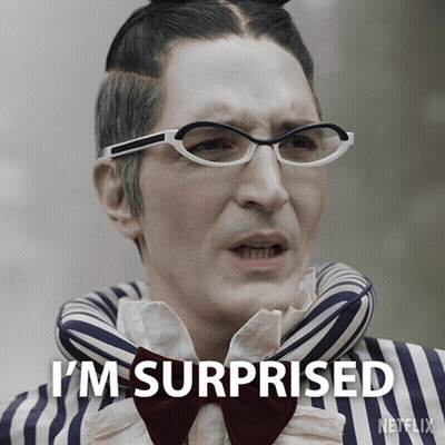 A Man Wearing Glasses And A Bow Tie Has The Words I 'M Surprised On His Face GIF