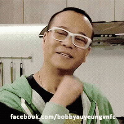 A Man Wearing Glasses And A Green Hoodie With Facebook.com/bobbyauyeungvnfc Written Below Him GIF