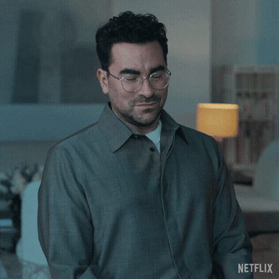 A Man Wearing Glasses And A Grey Jacket Says Of Course GIF
