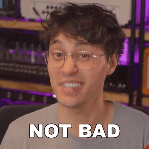 A Man Wearing Glasses And A Grey Shirt Says " Not Bad " GIF