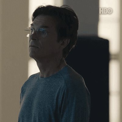 A Man Wearing Glasses And A Grey Shirt With Hbo On The Bottom Right GIF