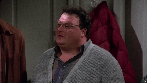 A Man Wearing Glasses And A Grey Sweater Says " Sometimes " GIF