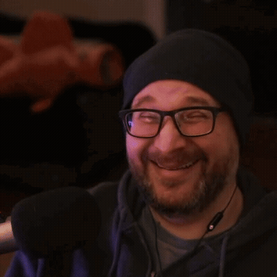 A Man Wearing Glasses And A Hat Gives Two Thumbs Up GIF
