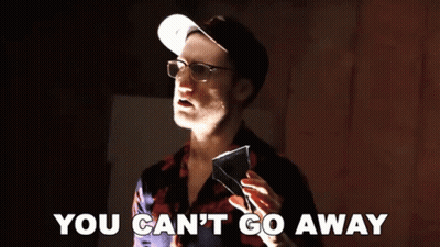 A Man Wearing Glasses And A Hat Is Holding A Piece Of Glass And Says You Can 'T Go Away GIF